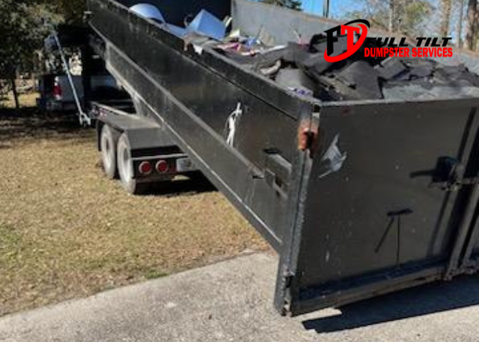 dumpster rental being loaded off someone's property in Macclenny, FL